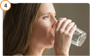 Woman drinking water after taking CREON® (pancrelipase) Delayed Release Capsules.